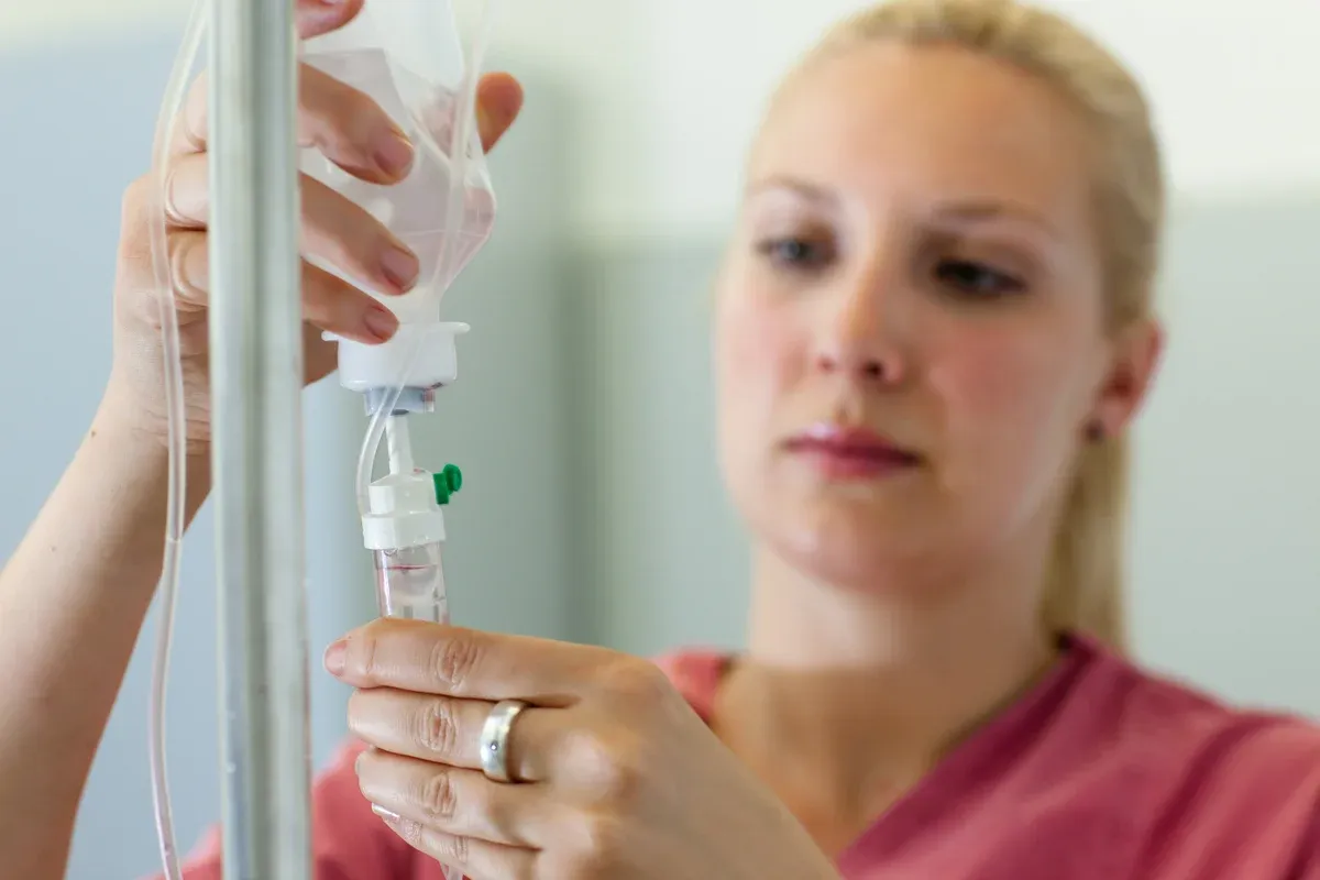 Clinician preparing an IV therapy drip — Ideal Medical & Wellness, Aventura